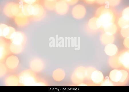 Frame made of Christmas lights on white background Stock Photo