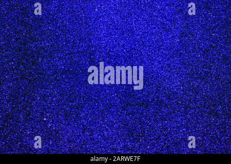 Navy blue background, rippled navy blue glitter sparkles and black spots Stock Photo