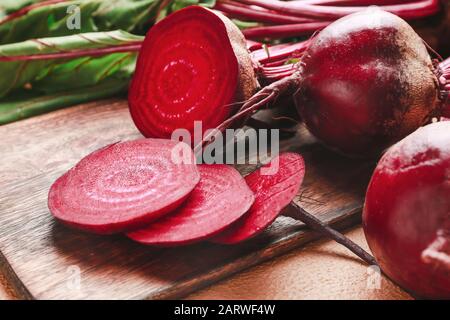 Fresh sliced beet on wooden board Stock Photo