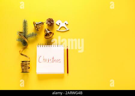 Beautiful Christmas composition with notebook on color background Stock Photo