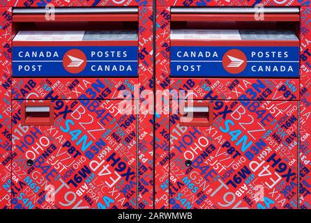 Brightly Coloured Canada Post Twin Canadian Mail Boxes, Banff, Alberta, Canada Stock Photo