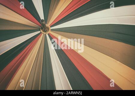 Abstract vintage background of old multicolored umbrella with texture Stock Photo