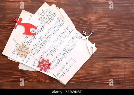 Note sheets and Christmas decor on table Stock Photo