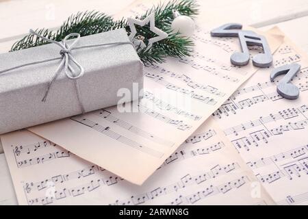 Note sheets, gift and Christmas decor on table Stock Photo