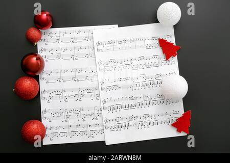 Note sheets and Christmas decor on table Stock Photo