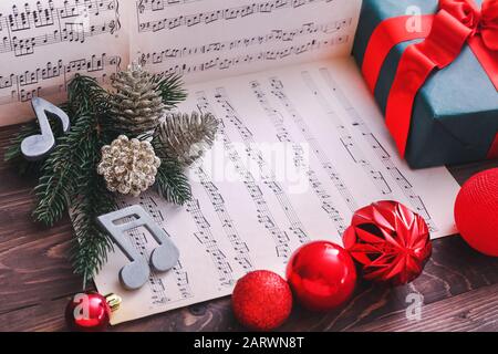 Note sheets, gift and Christmas decor on table Stock Photo