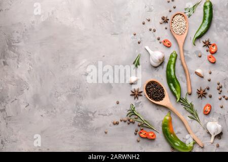 Different spices on grey background Stock Photo