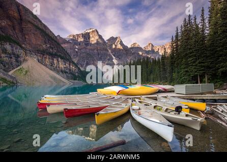 Multicoloured Canoes on Moraine Lake, Valley of the Ten Peaks, Banff National Park, Canadian Rockies, Alberta, Canada Stock Photo