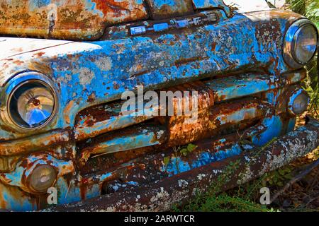 White, GA / USA - October27, 2018 - Close up Image of the Front of an Old Rusted Dodge Truck in a Junk Yard Stock Photo