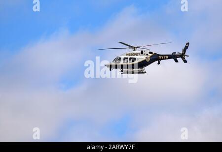 NEW YORK CITY (MANHATTAN), NY / USA -JANUARY 24, 2018: New York Police Department (registration N920PD) patrolling the city's airspace in Manhattan. Stock Photo