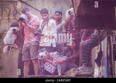 Vrindavan, India - March 12 2017: Photographers at Holi festival in Vrindavan, India. Stock Photo