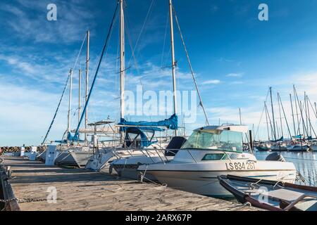 Marseillan, France - December 30, 2018: Pleasure boat docked in the small port of Marseillan on a winter day Stock Photo