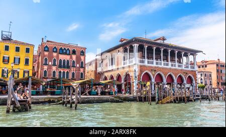 Venice, Italy – May 18, 2017: Old buildings on Grand Canal in Venice. Traditional cityscape of Venice in summer. Panorama of vintage houses on embankm Stock Photo
