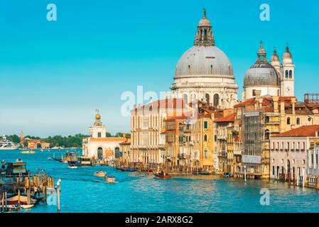 Basilica Santa Maria della Salute on the Grand Canal, Venice, Italy. Panorama of Venice on a sunny day in summer. Venice in the sunlight. Cityscape an Stock Photo