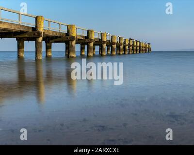 Old wooden pier at the coast