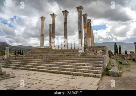 Archaeological Site of Volubilis is a partly excavated Berber city in Morocco situated near the city of Meknes, Morocco Stock Photo