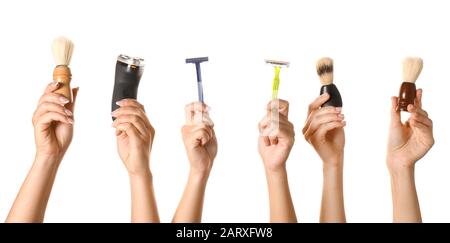 Hands with different tools for shaving on white background Stock Photo