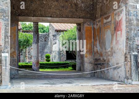 Ruins of a house in Pompeii, Italy. Pompeii is an ancient Roman city died from the eruption of Mount Vesuvius in 79 AD. Stock Photo