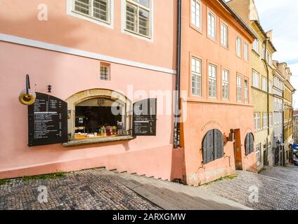 A snack bar opens it's windows on the grand staircase leading to the Prague Castle complex in Prague, Czech Republic Stock Photo