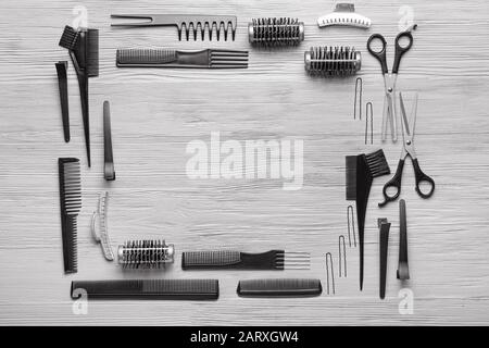 Frame made of hairdresser tools and accessories on grey wooden background Stock Photo