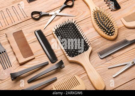 Set of hairdresser tools on wooden background Stock Photo