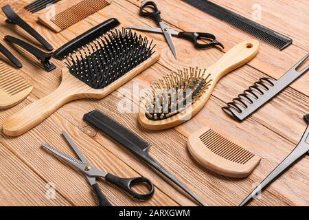 Set of hairdresser tools on wooden background Stock Photo