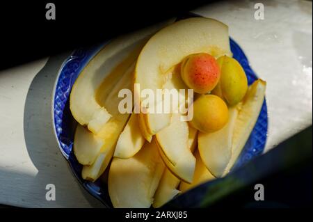 Melon's slices with fresh peach. Melon slices and apricot Stock Photo