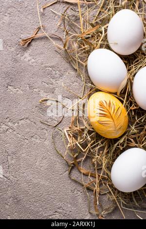 Easter painted chicken golden egg Stock Photo