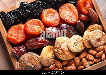 Different dried fruits and nuts in box Stock Photo