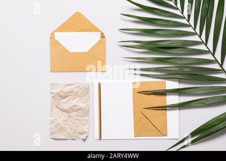 Mockups of invitations with envelopes on white background Stock Photo