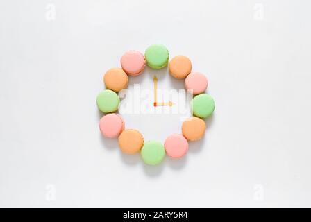 Creative composition with macarons on white background Stock Photo