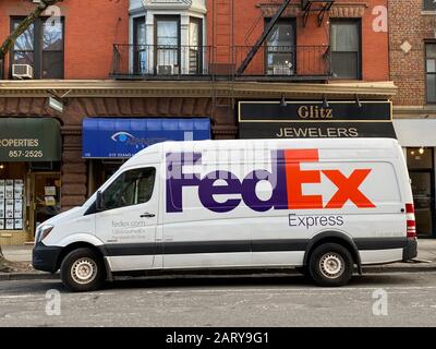 FedEx delivery van parked on 7th Avenue in Park Slope, Brooklyn, New York. Stock Photo