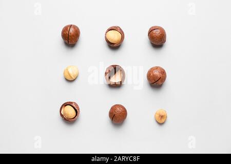 Tasty macadamia nuts on light background Stock Photo
