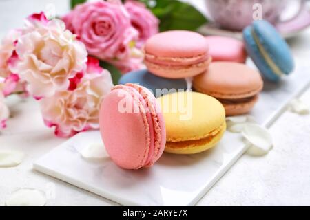 Different tasty macarons on white table Stock Photo
