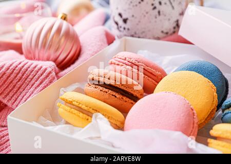 Different tasty macarons on table, closeup Stock Photo