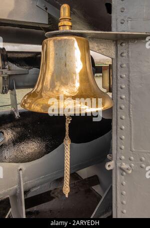 Oahu, Hawaii, USA. - January 10, 2020: Pearl Harbor. Closeup of gold colored shiip bell of long submarine USS Bowfin. Stock Photo