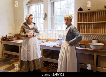 Actors playing historic staff and servant roles at Audley End House, Essex, UK Stock Photo