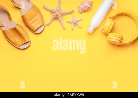 Composition with beach accessories on color background Stock Photo