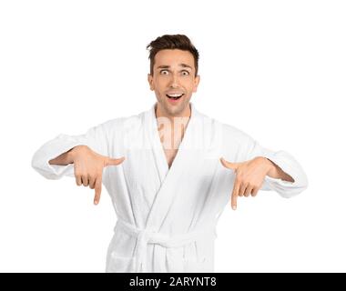 Excited man in bathrobe pointing at something on white background Stock Photo