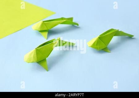 Cute origami fish on color background Stock Photo