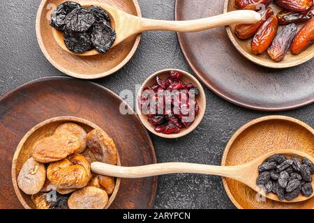 Different dried fruits on dark background Stock Photo