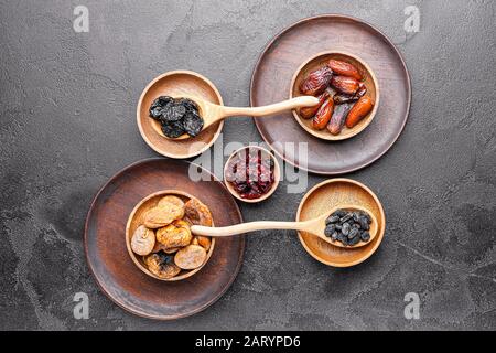 Different dried fruits on dark background Stock Photo