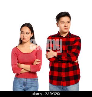 Quarrelled Asian couple on white background Stock Photo