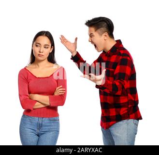 Quarrelling Asian couple on white background Stock Photo