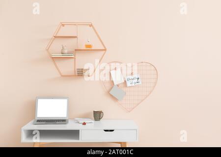Modern comfortable workplace near color wall Stock Photo