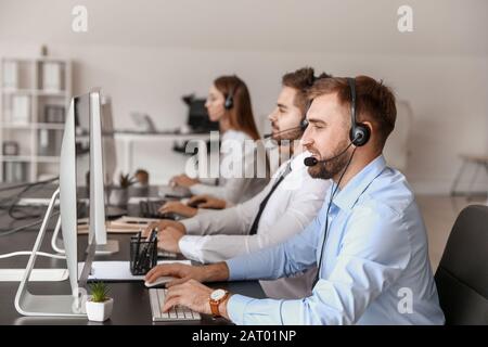 Technical support agents working in office Stock Photo - Alamy