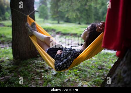 Woman lying in hammock in Appenzell, Switzerland Stock Photo