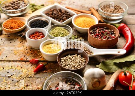 Different spices on wooden background Stock Photo