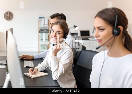 Team of technical support agents working in office Stock Photo