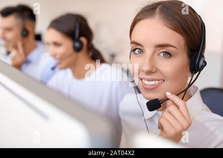 Female technical support agent working in office Stock Photo